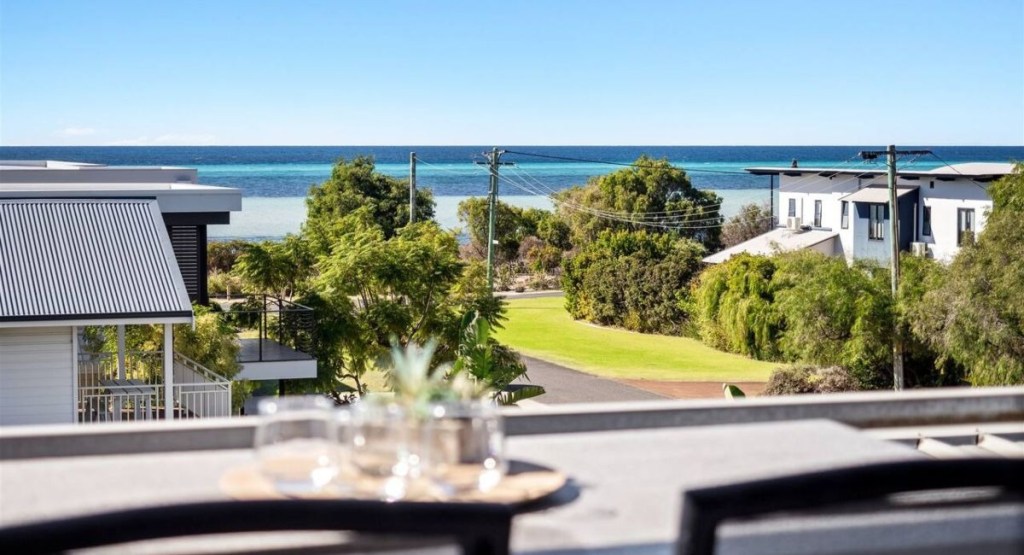 A view of the beach from the balcony of a Dunsborough accommodation
